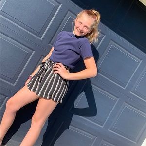 black, white, and pink loose shorts with a tie